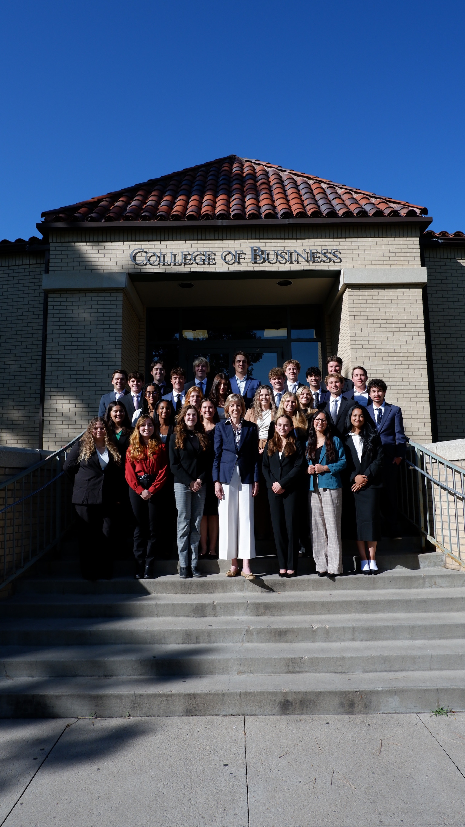 DSLC members with the Dean on the steps of the College of Business